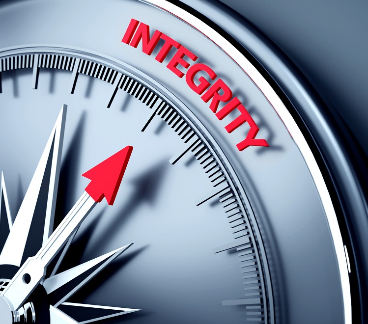 Compass with arrow pointing to the word "integrity"